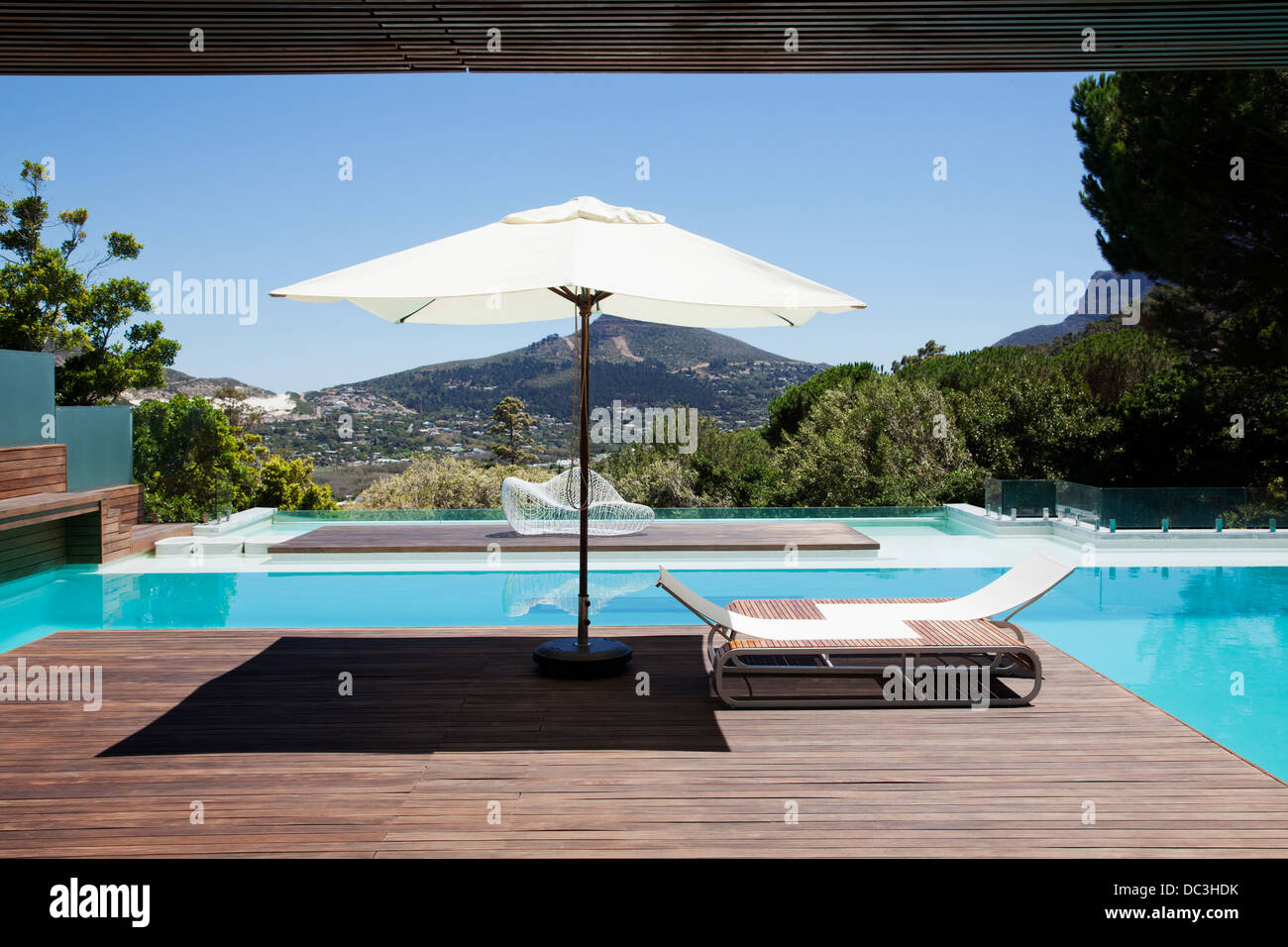Swimming pool overlooking mountains Stock Photo