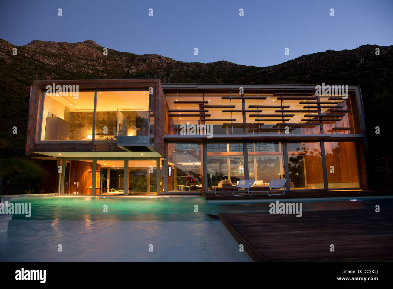 Illuminated modern house at night Stock Photo