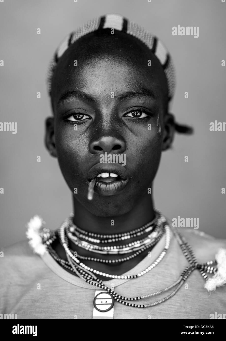 Hamer Young Man With A Stick In His Mouth, Dimeka, Omo Valley, Ethiopia Stock Photo