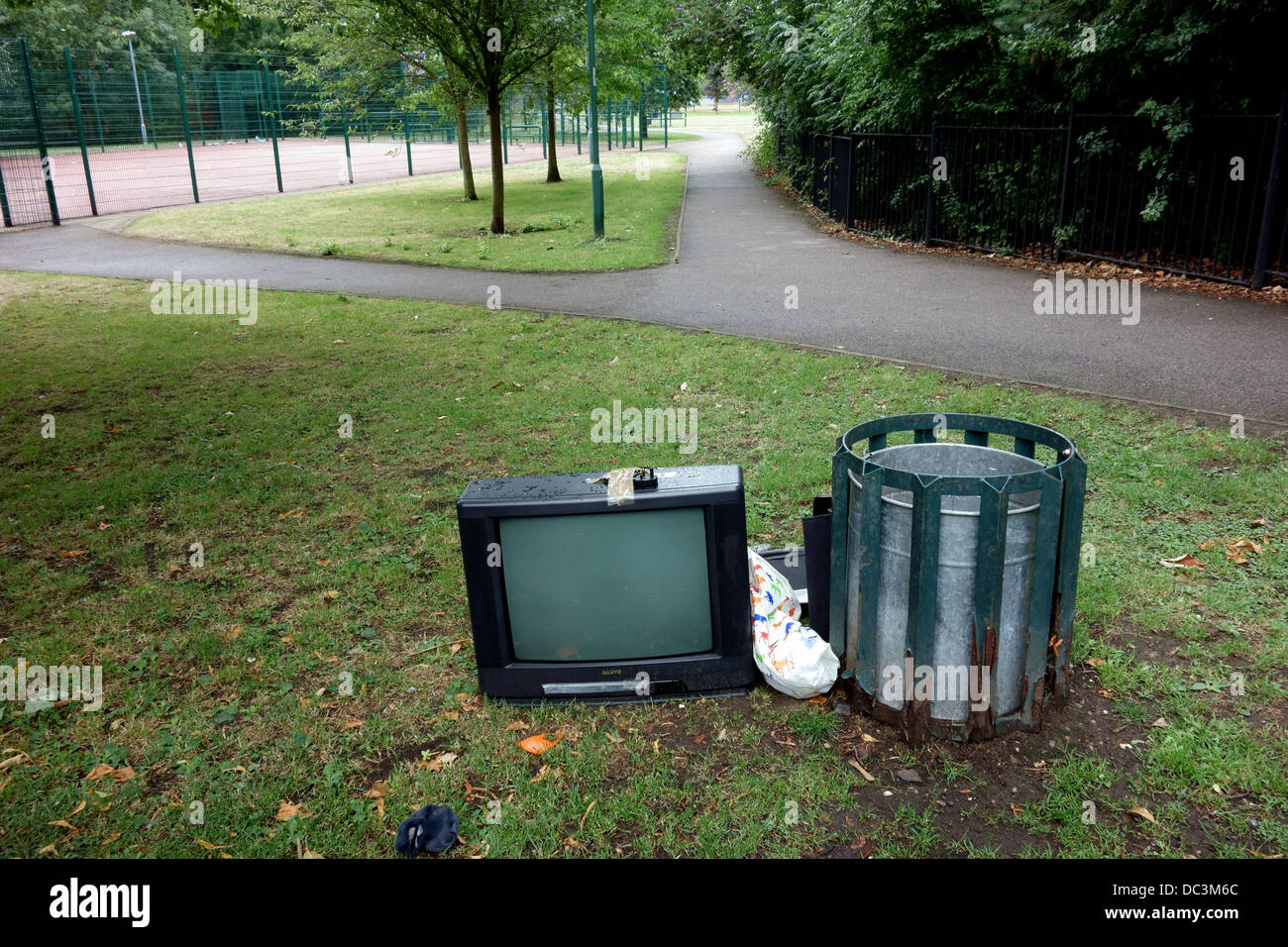Fly-tipped television set in South London park Stock Photo