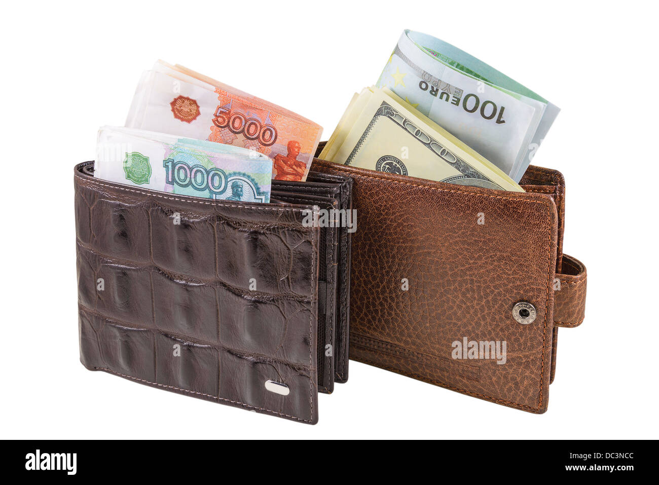 The two brown leather wallet with euro, dollars and rubles is photographed on the close-up Stock Photo