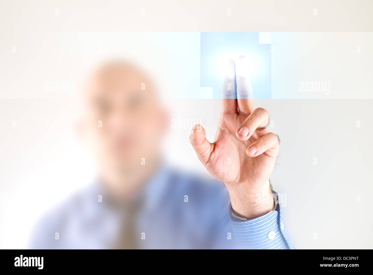 Businessman pressing touch screen button. Modern business technology