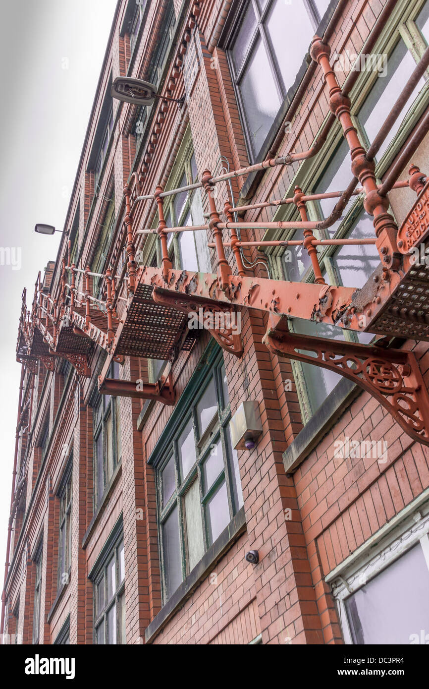 Fire escape up the side of an old warehouse Stock Photo Alamy
