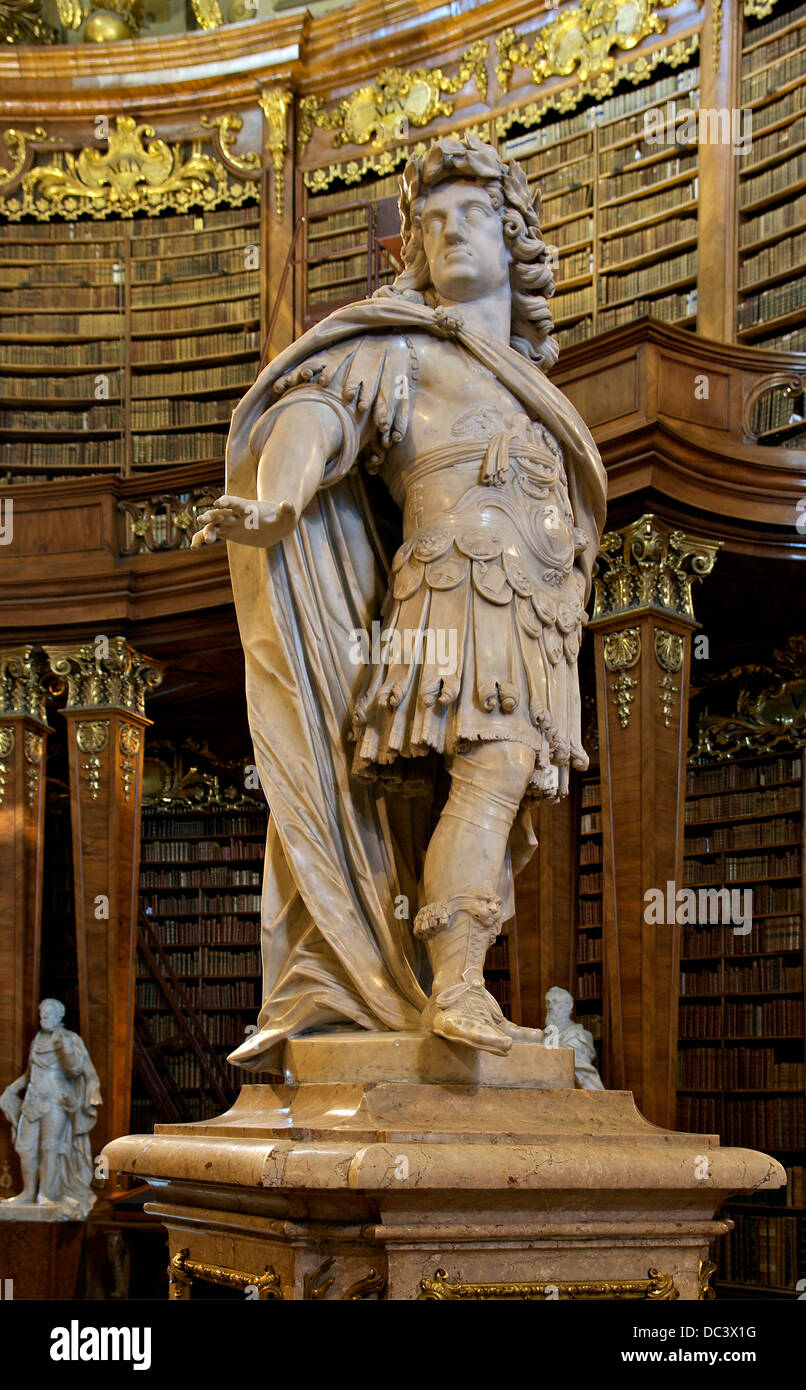 Ancient statue in Charles VI, Holy Roman Empire, by Peter and Paul Strudel, the center of the Prunksaal, the State National Libr Stock Photo