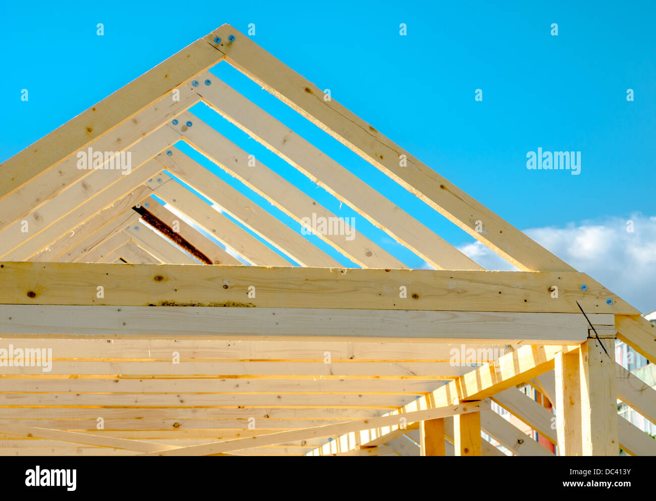 Rafters of the roof frame of a house under construction Stock Photo