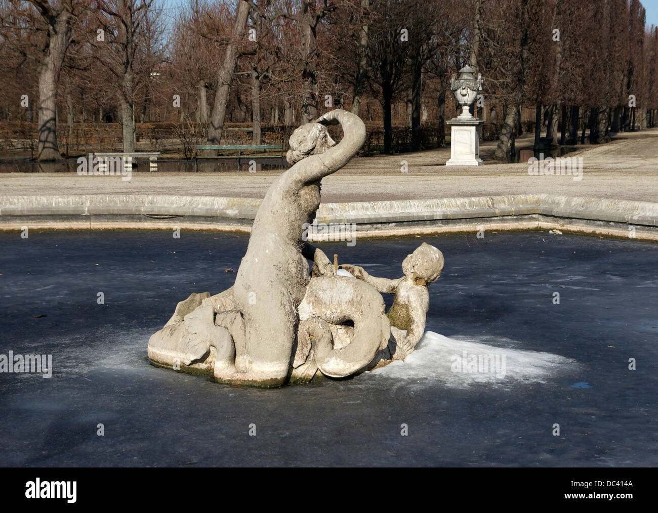 frozen pond and fountain in the gardens of Schönbrunn Castle, Vienna, Austria. Stock Photo