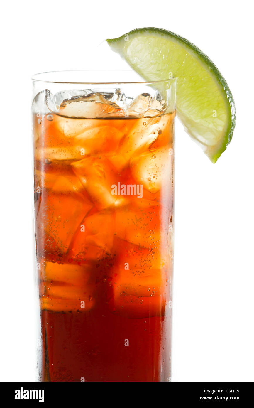 cuba libre, rum and cola cocktail served in a tall glass with a lime