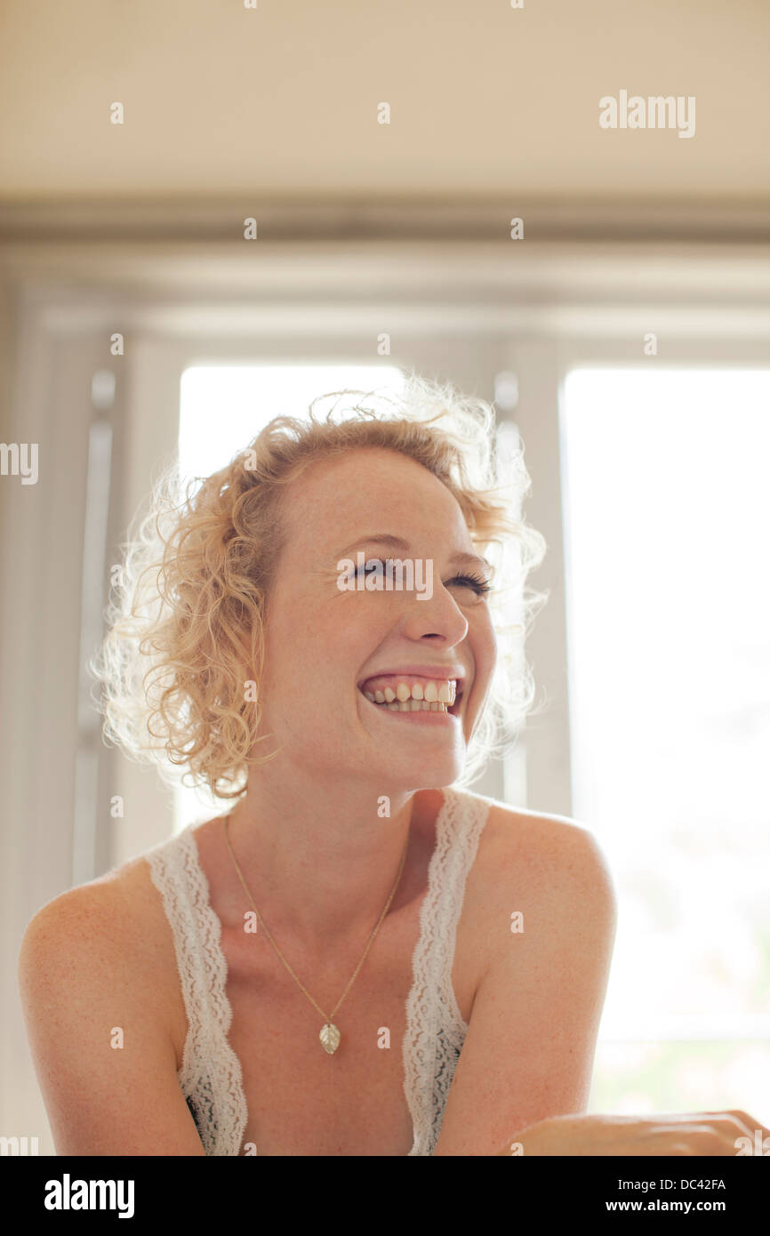 Enthusiastic woman looking up Stock Photo