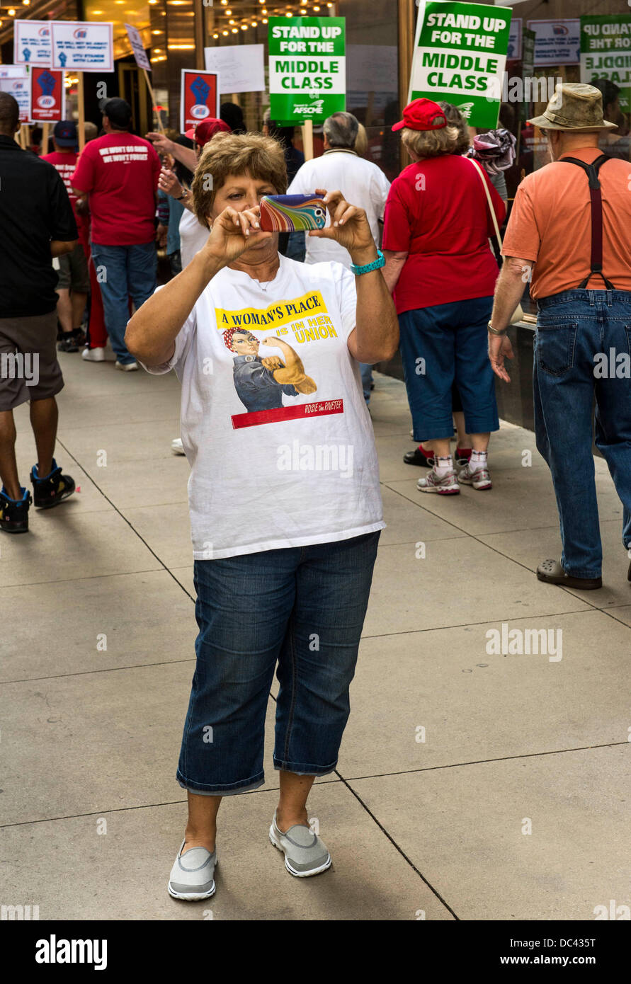 Aug. 08, 2013 - Chicago, Illinois, U.S. -  A coalition of community, labor and environmental groups protest outside the Palmer House, where the American Legislative Exchange Council (ALEC) is holding its 40th annual meeting.  ALEC produces model legislation which Republican-controlled state legislatures have been adopting to restrict voter rights, gut environmental laws, repeal the minimum wage, support the fossil fuel industry and restrict health care options for women.(Credit Image: © Brian Cahn/ZUMAPRESS.com) Stock Photo