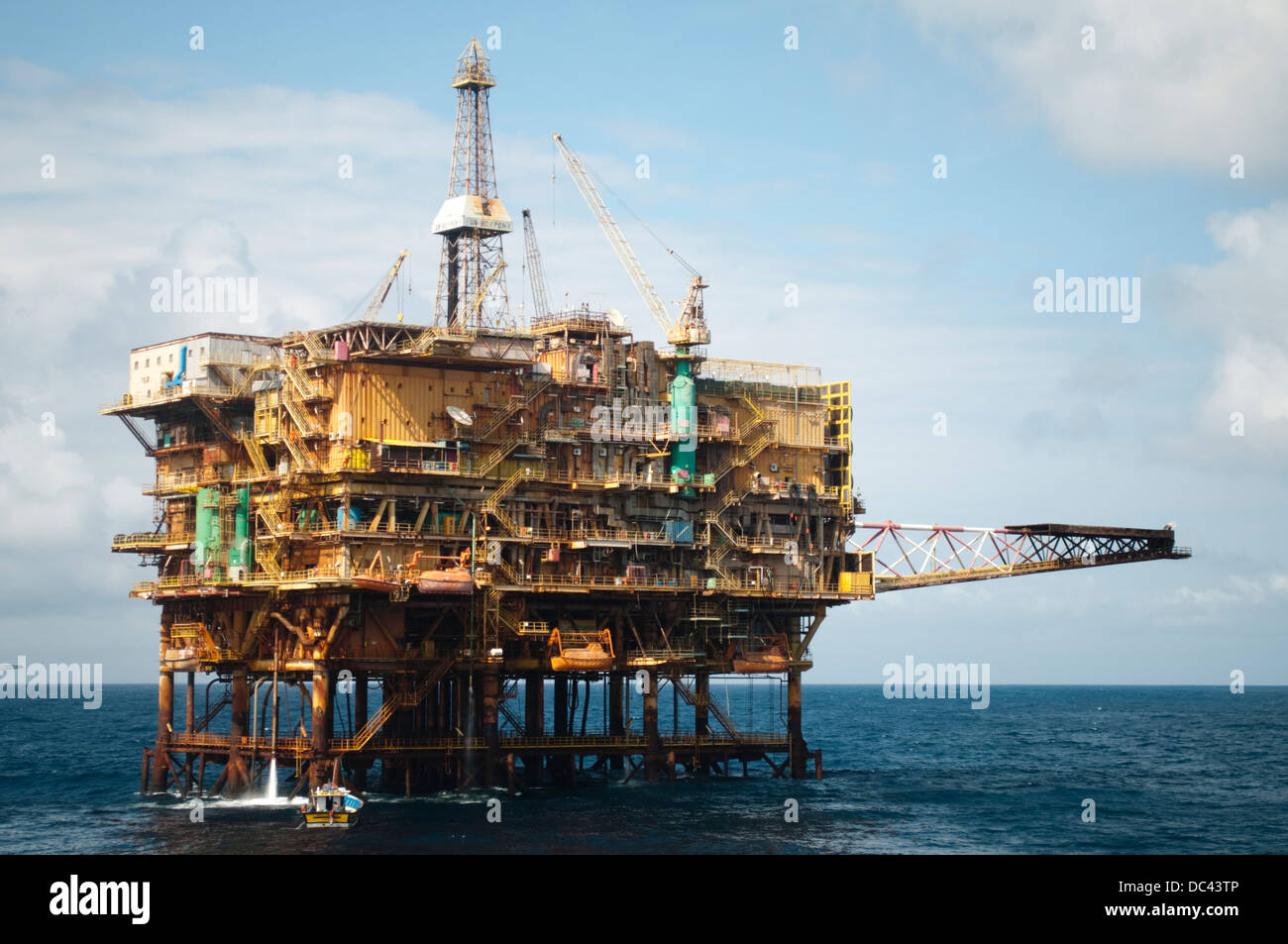 small fishing boat moored on offshore oil rig PCH-01, working for ...