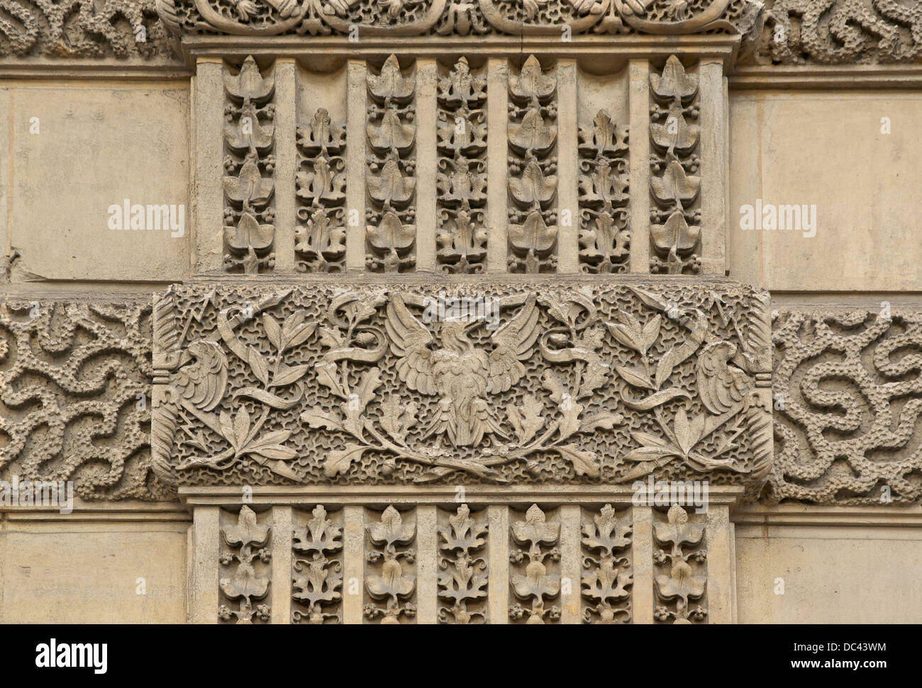 Imperial eagle and thunderbolts on a wall of the Louvre Palace in Paris. Stock Photo