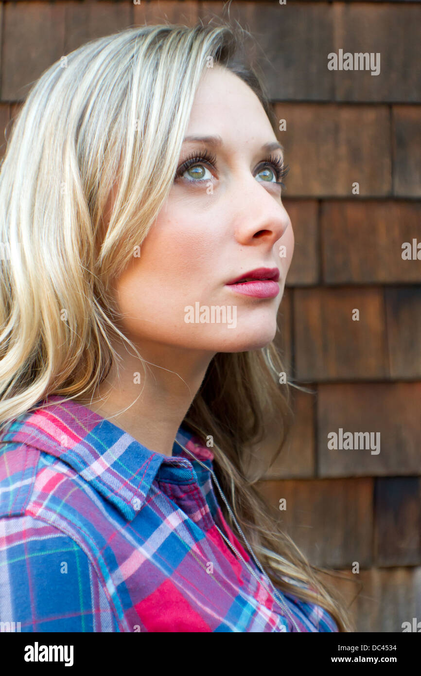 Portrait of a young woman outdoors Stock Photo - Alamy