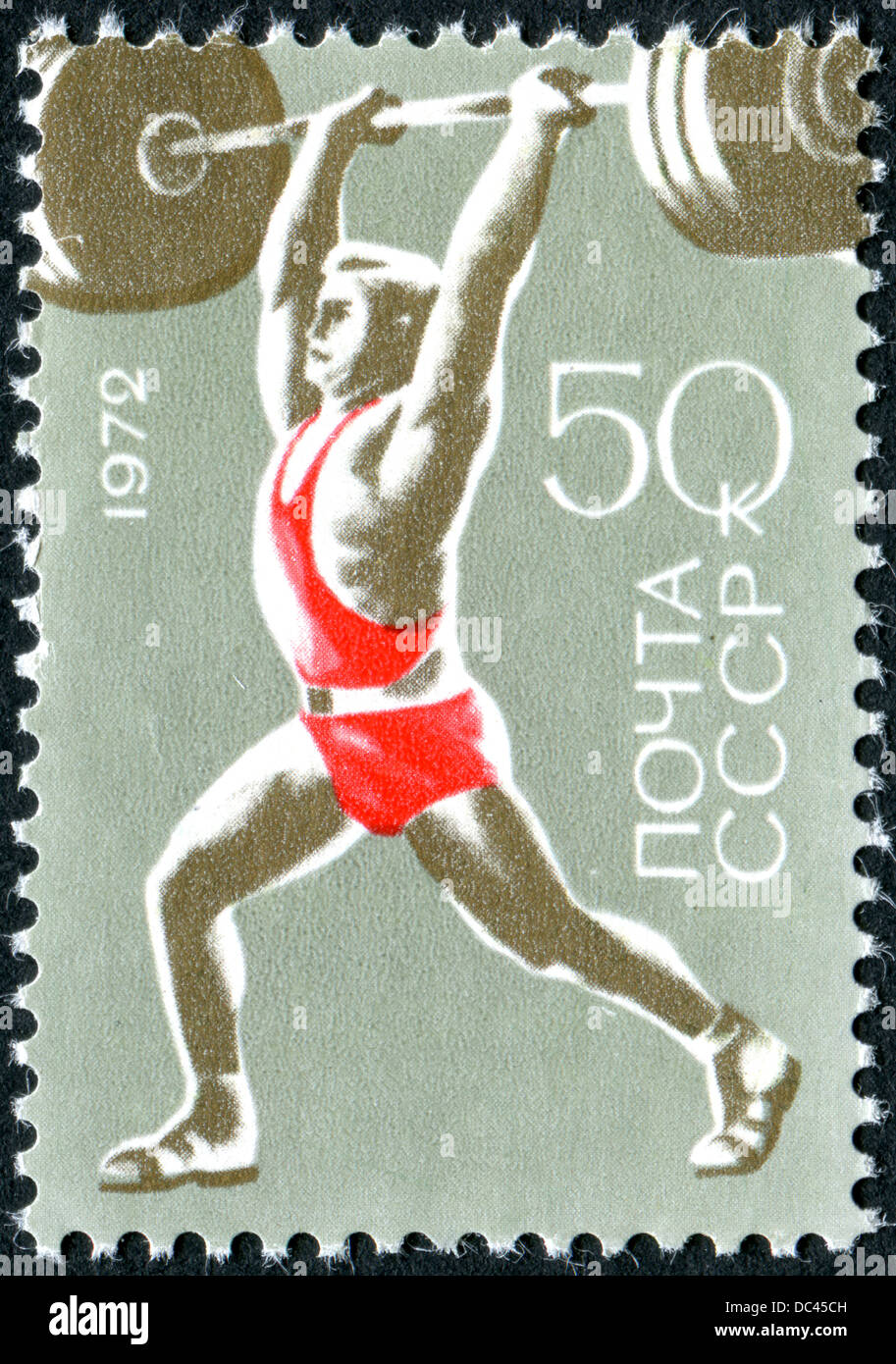 USSR - CIRCA 1972: A stamp printed in the USSR devoted Summer Olympic Games in Munich, shows weightlifter, circa 1972 Stock Photo