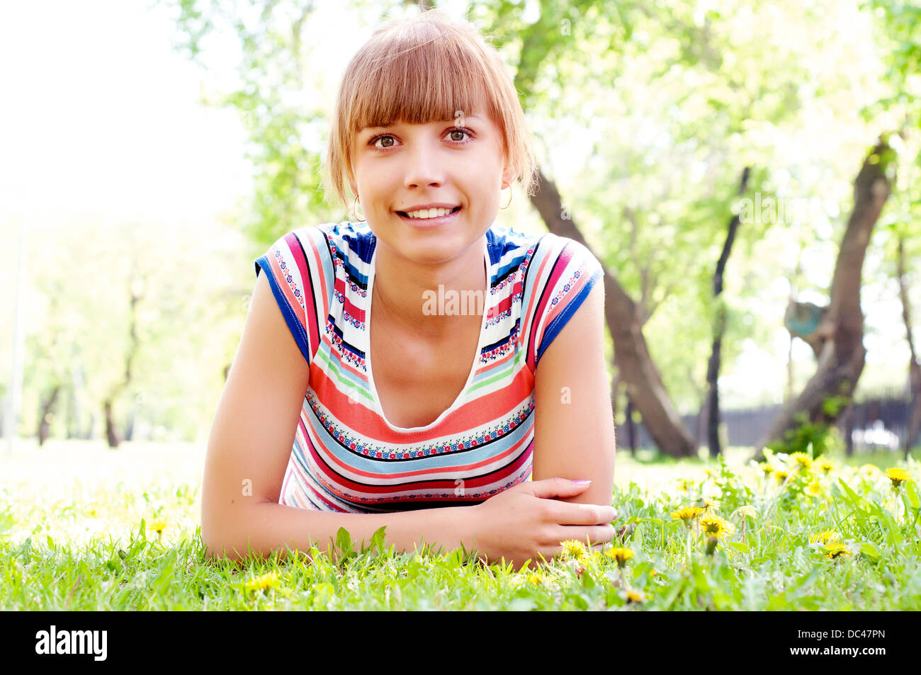 portrait of a beautiful woman in summer park Stock Photo - Alamy