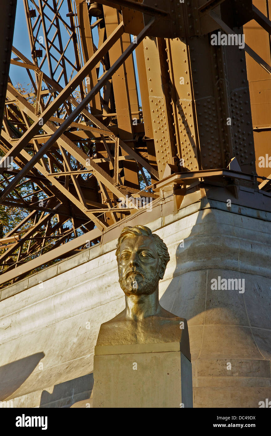 Gilded bronze bust of Gustave Eiffel, by Antoine Bourdelle. One can see behind the basis of the northern pillar of the Tower. Stock Photo