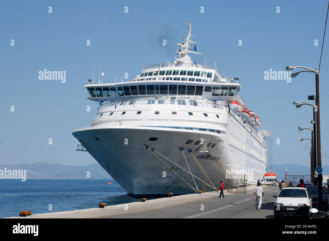 M.S. Louis Majesty (ex Royal Majesty, ex Norwegian Majesty), at dock in the harbour of Rhodes, Island of Rhodes, Greece. in back Stock Photo