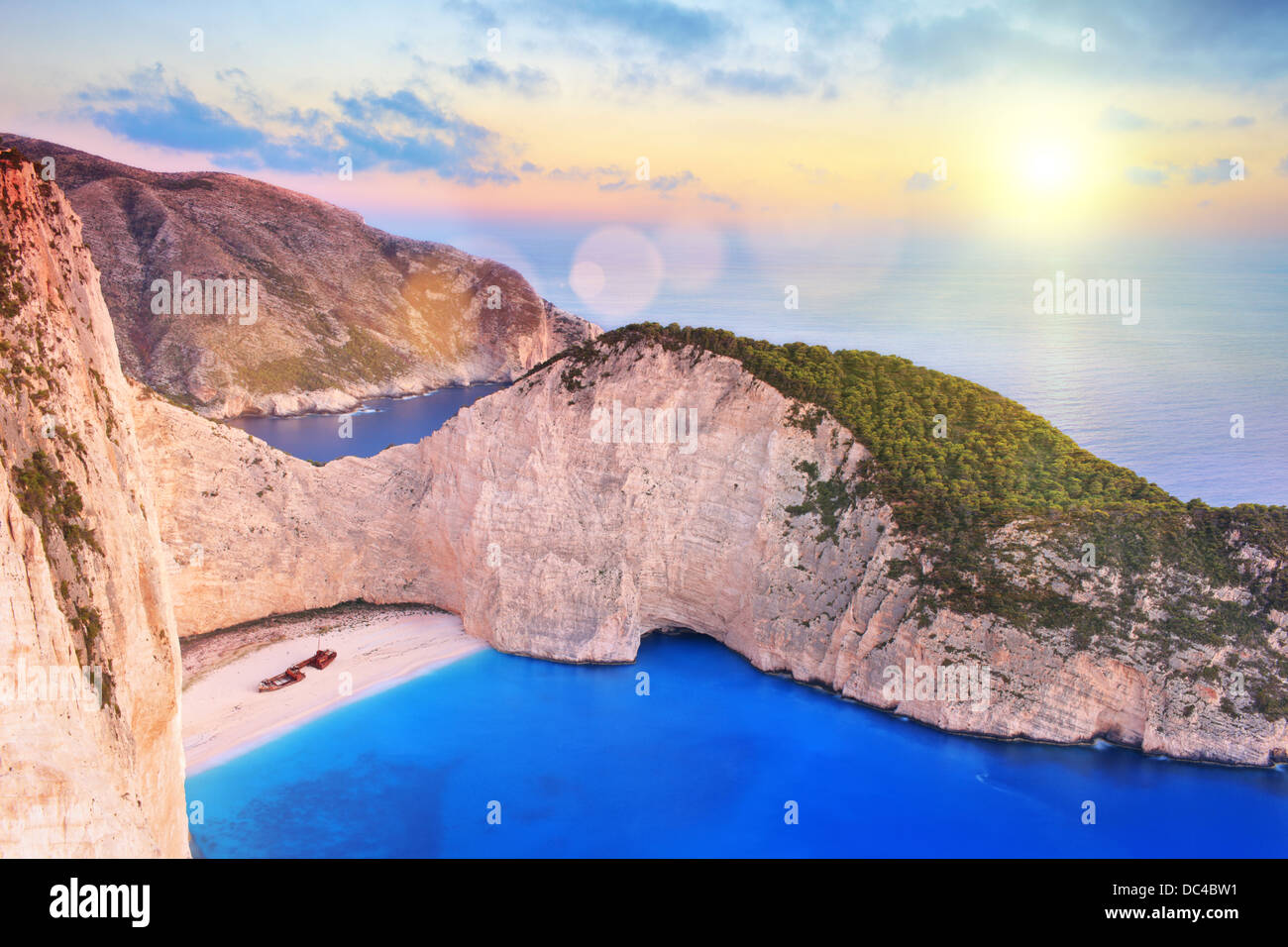 View of Zakynthos island, Greece with a shipwreck on a beach, at sunset Stock Photo