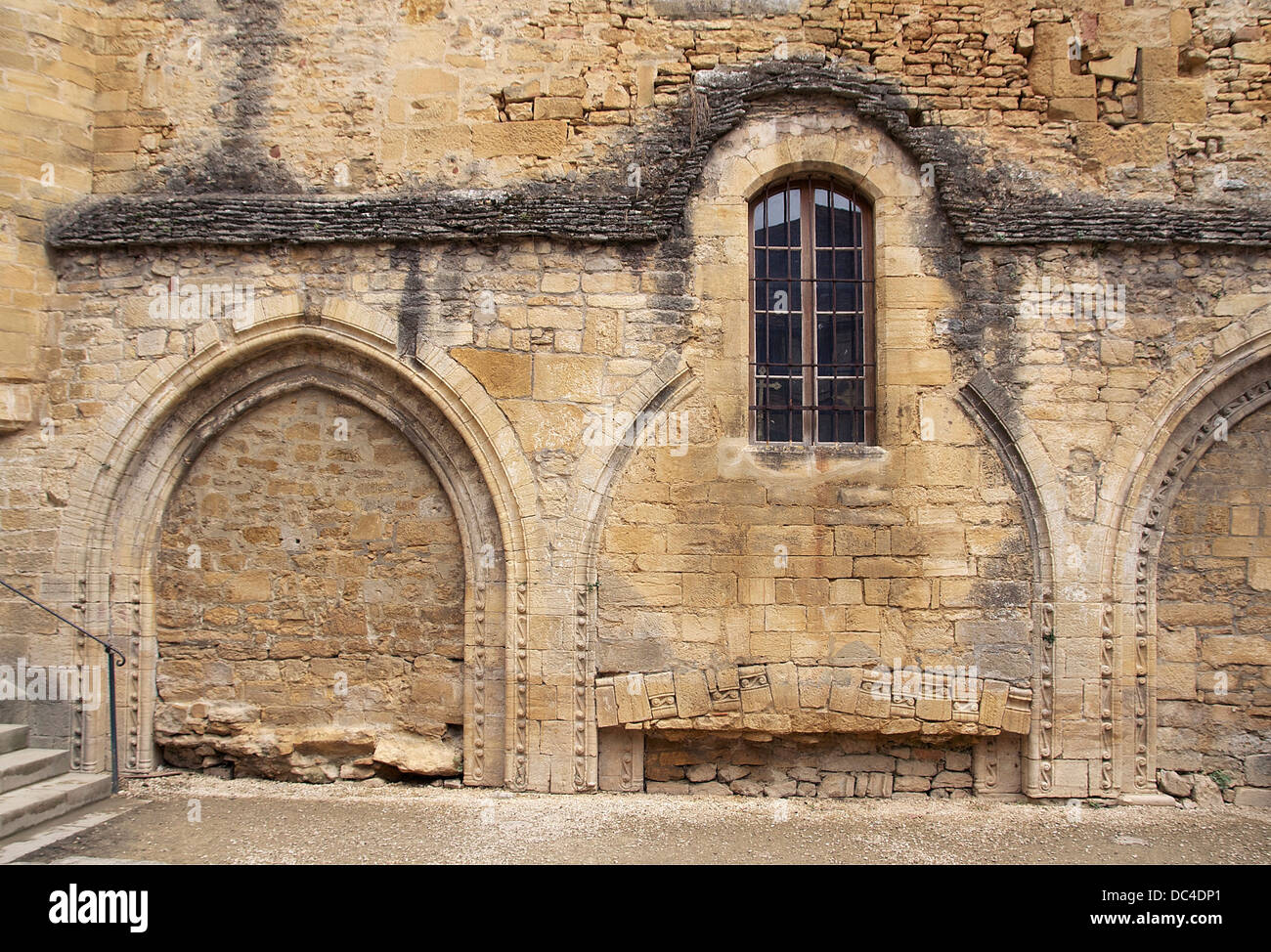 Along the former cathedral, a wall (12th, 16th centuries) of a chapel in Sarlat, Dordogne, France. Stock Photo