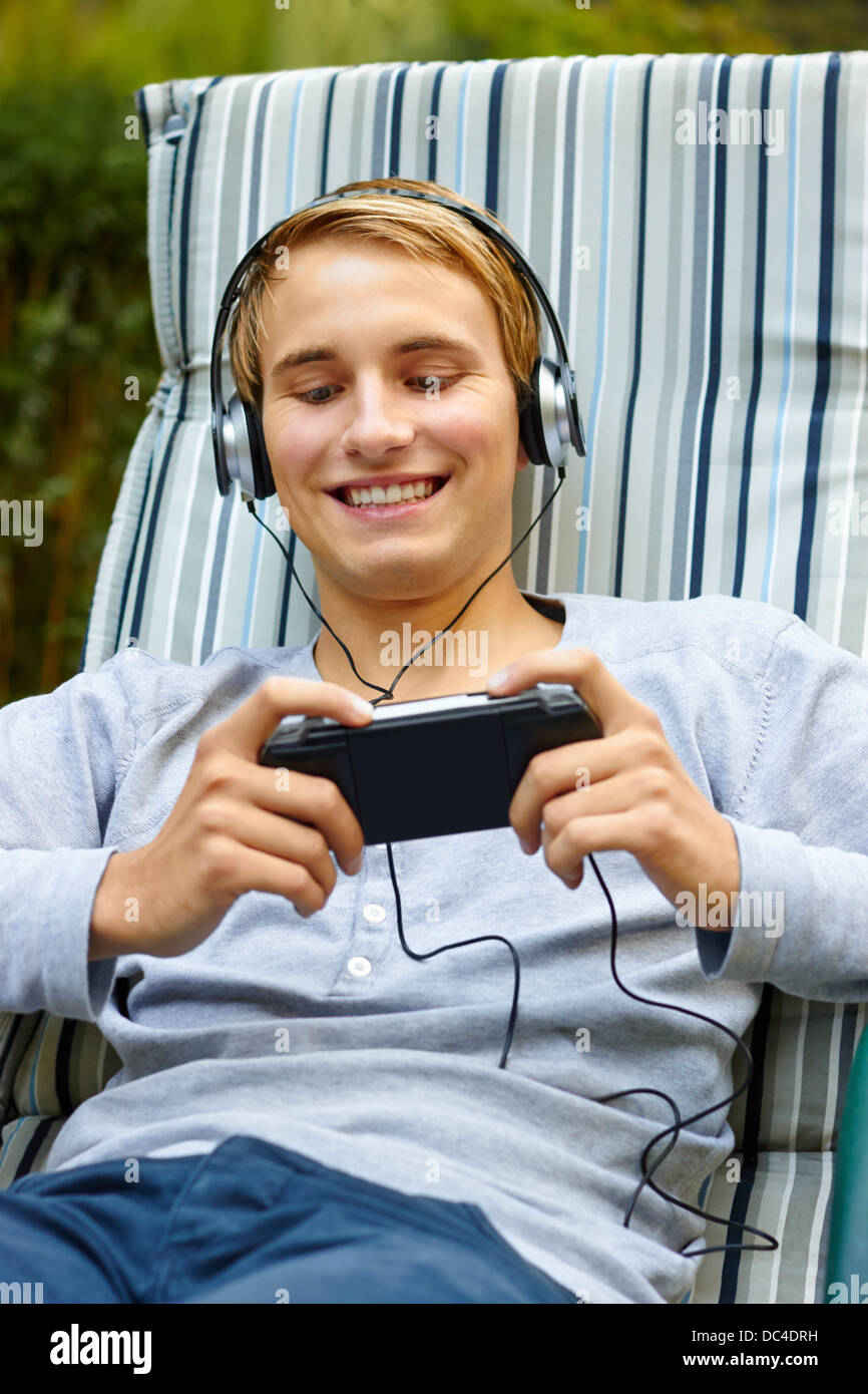 Youth playing on game console Stock Photo