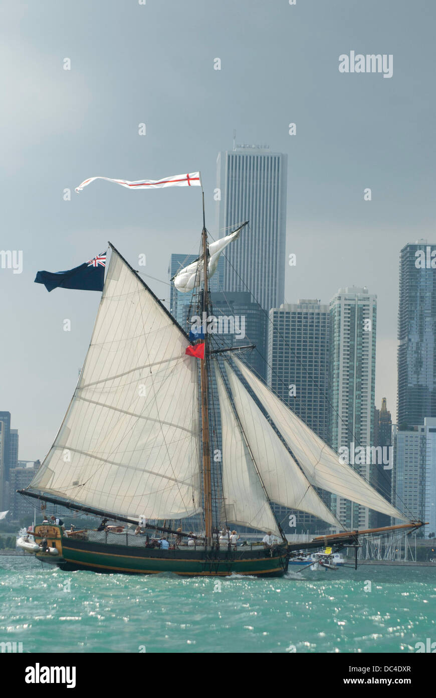 Chicago, Illinois, USA. 7th Aug, 2013. Tall ships arrive in Chicago. Crowd gather at Navy Pier to watch the parade of boats as a downpour deluged the crowd and boats, forcing many of the boats to douse their sails. (Credit Image: © Karen I. Hirsch/ZUMA Wire) Stock Photo