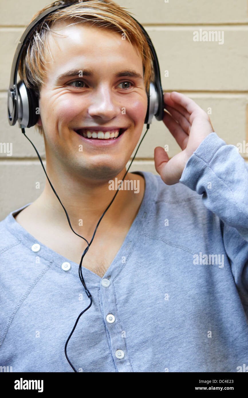 Young good looking male enjoying the music on his headphones Stock Photo