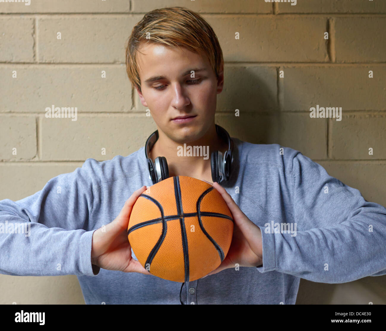 Young cool male thinking of basketball game Stock Photo