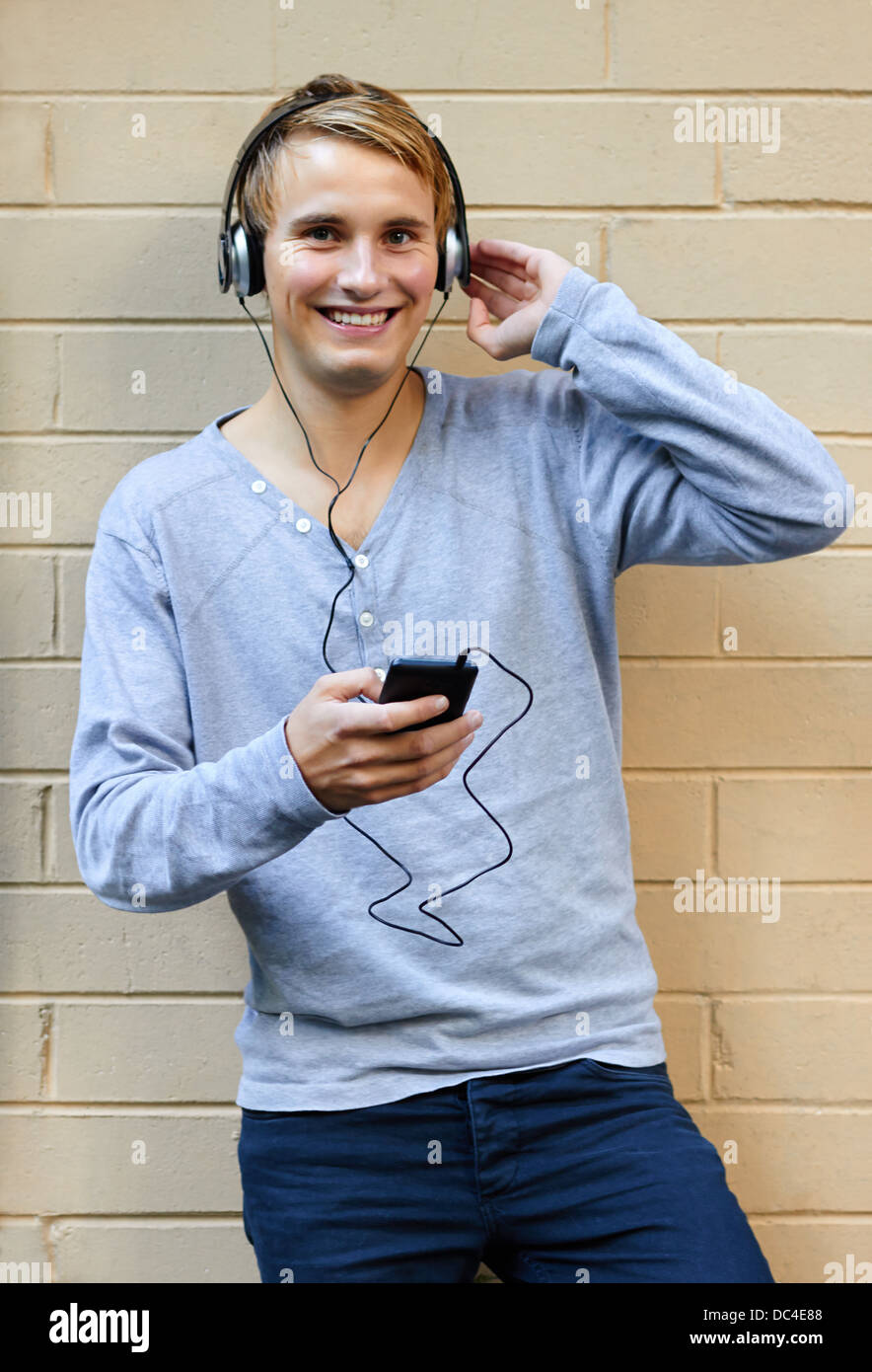 Young male listening to music on phone Stock Photo