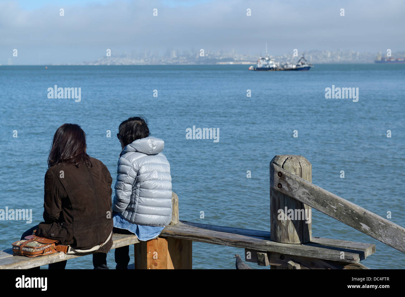 Sitting along the waterfront, Sausalito, CA with SF in the distance Stock Photo