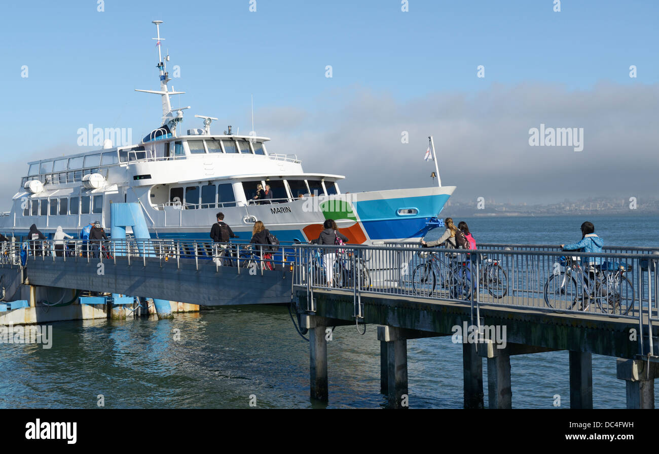 Passengers with bikes boarding ferry to SF, Sausalito, CA Stock Photo