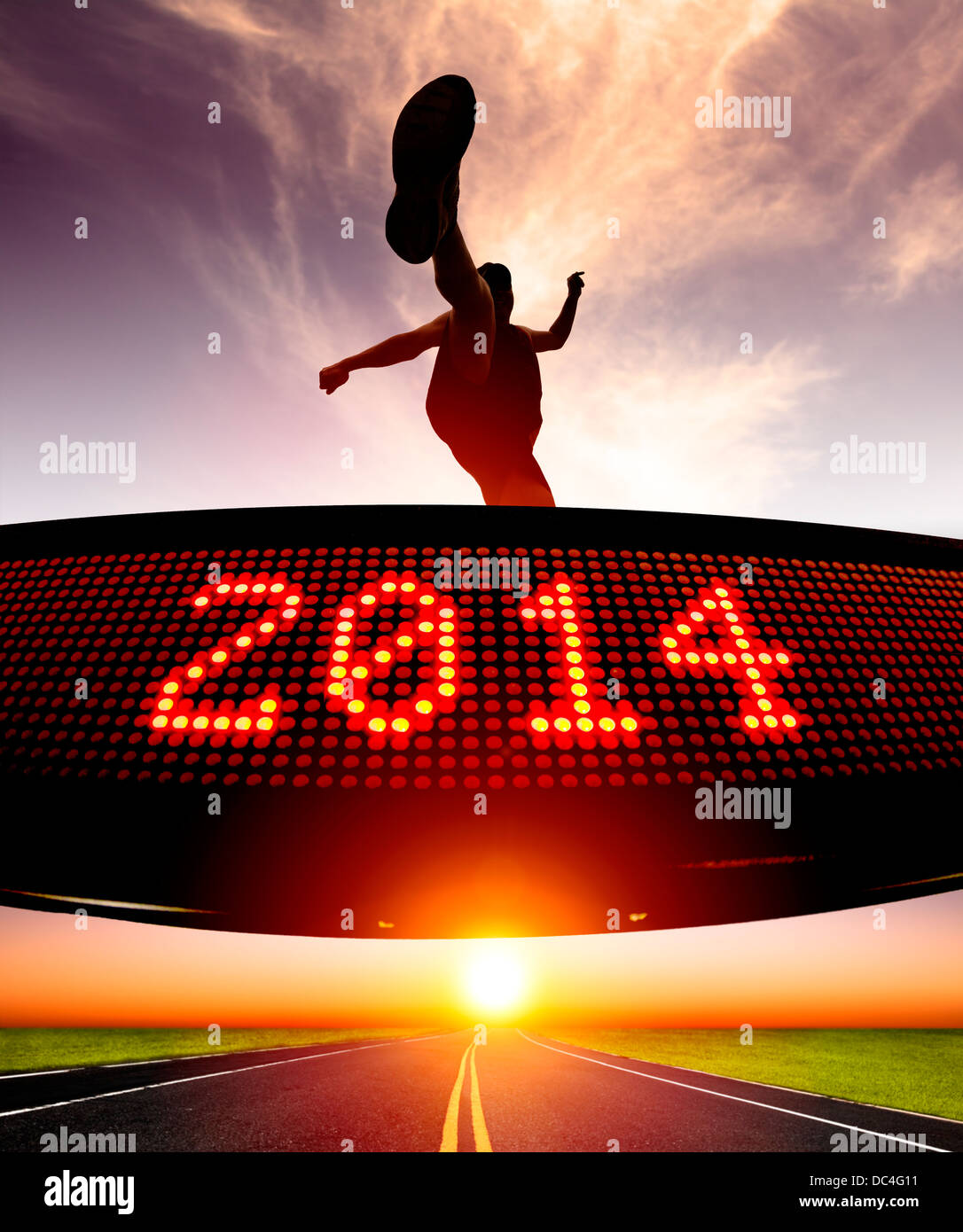 happy new year 2014.runner jumping and crossing over matrix display for celebrating 2014 Stock Photo