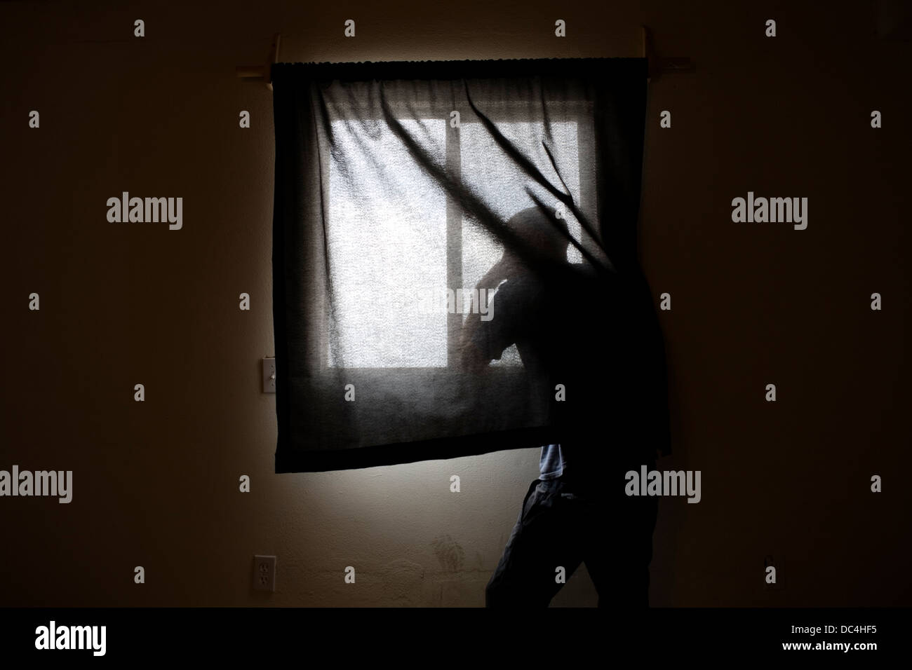 A man looking out of the window. Stock Photo