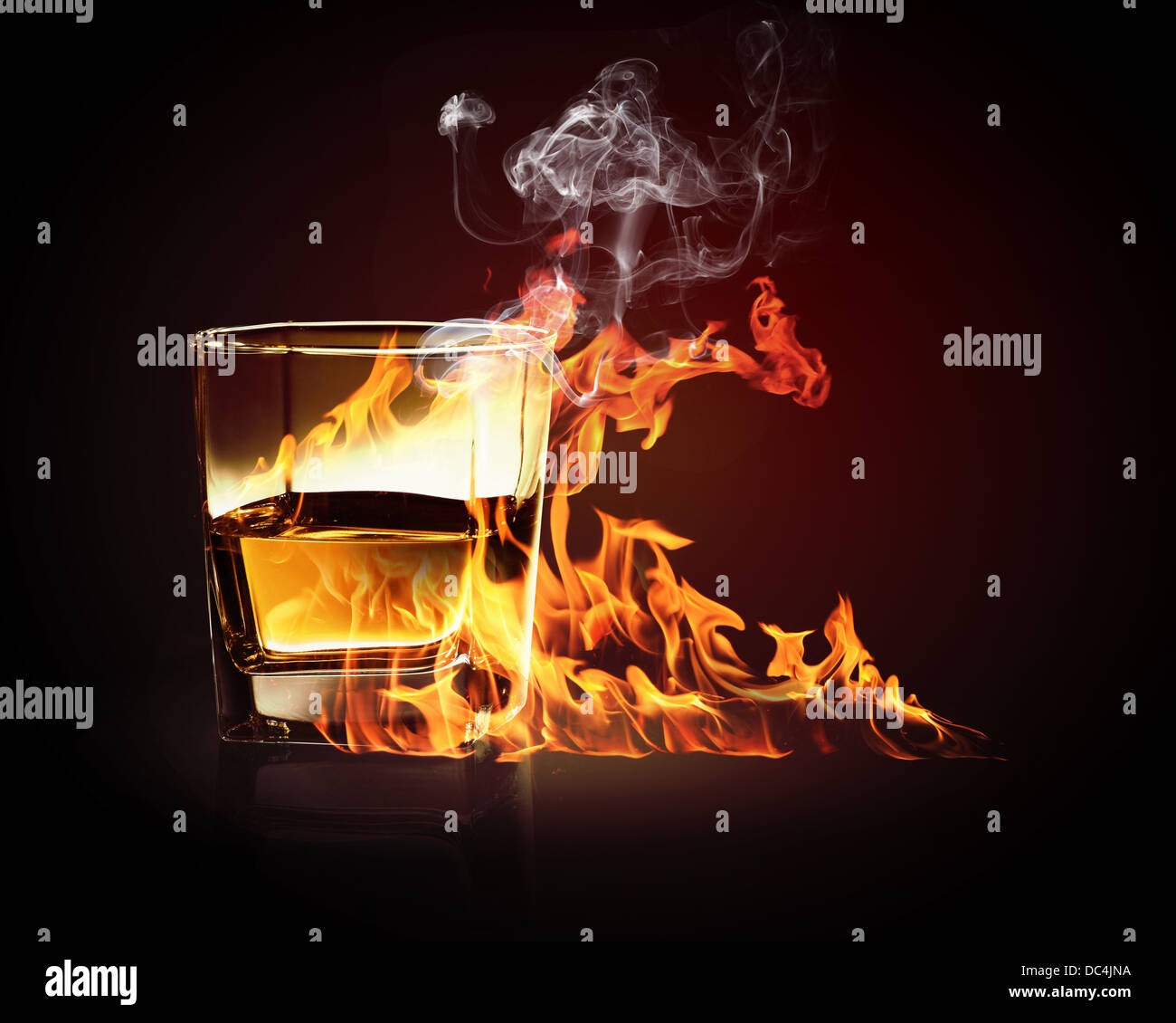 Glass of burning yellow absinthe Stock Photo Alamy