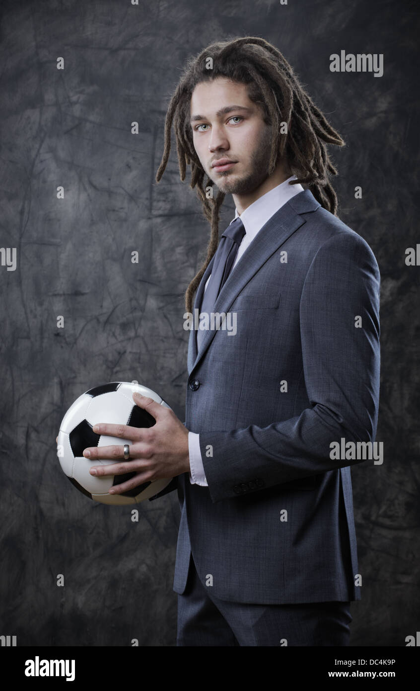 Young businessman with a soccer ball Stock Photo - Alamy