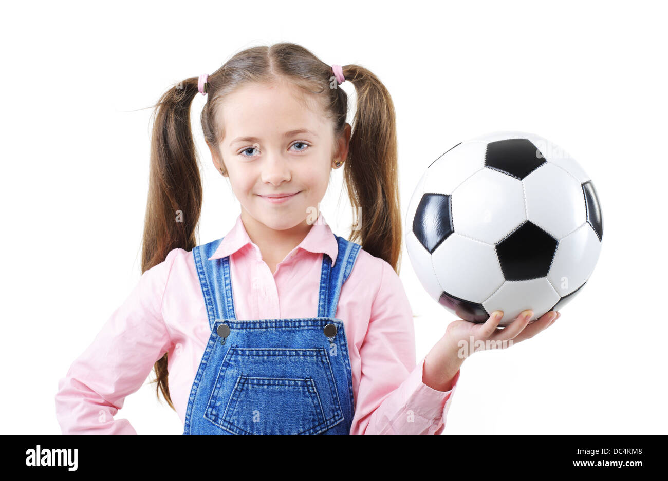 Pretty young girl holding a soccer ball Stock Photo Alamy
