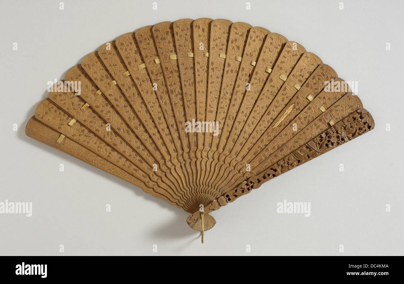 The Brise Fan 33.32 is an intricately designed handheld fan, featuring delicate patterns and craftsmanship. This piece exemplifies the elegance and decorative arts of its period, often used as both a functional and ornamental item. Stock Photo