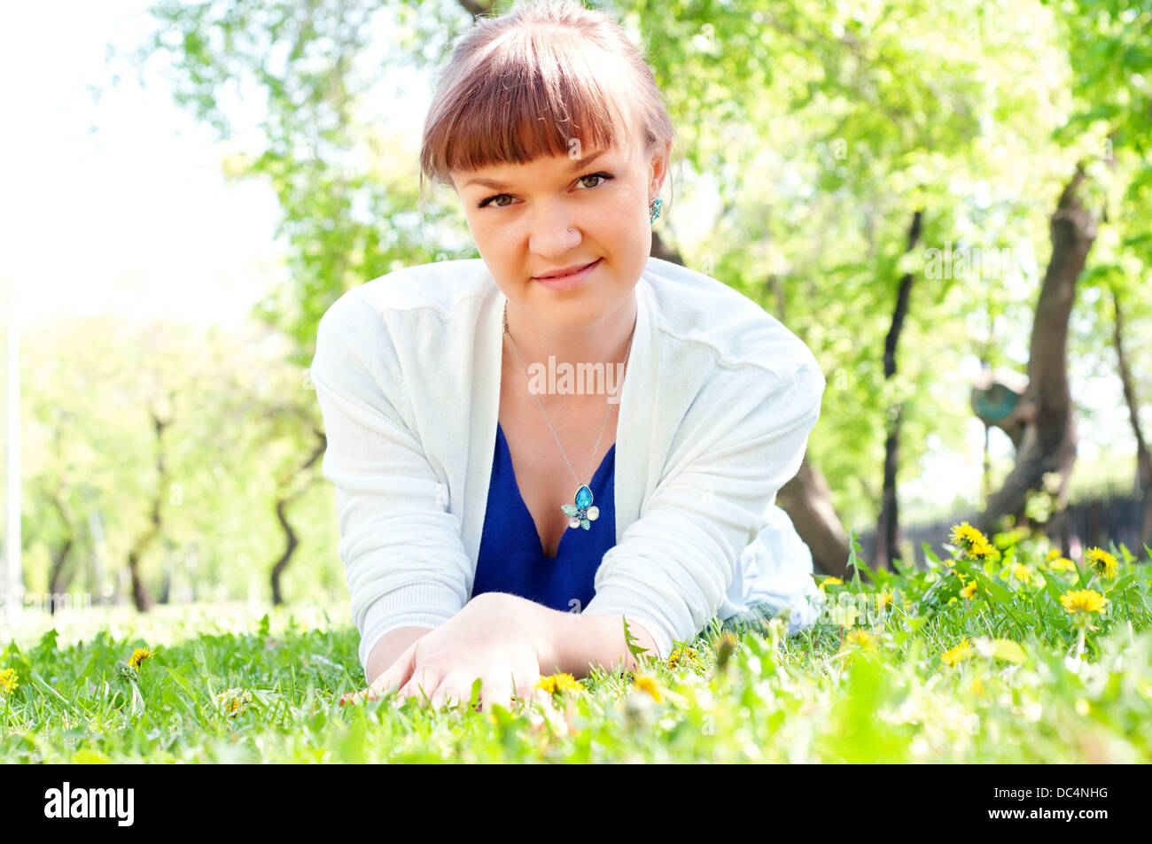 portrait of a beautiful woman in summer park Stock Photo - Alamy