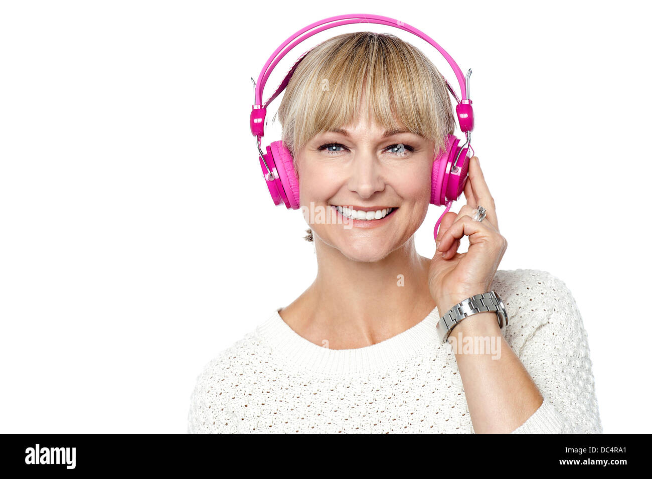 Portrait of a cheerful woman with headphones on Stock Photo - Alamy