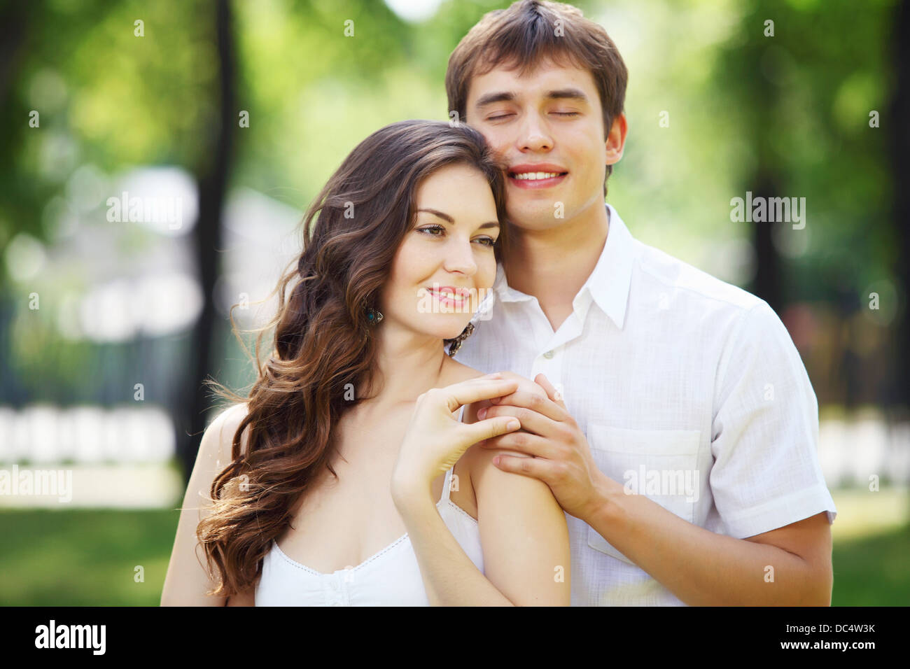 Young love Couple smiling under blue sky Stock Photo - Alamy
