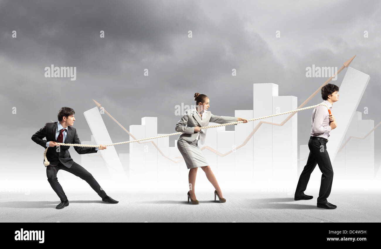 Three business people pulling rope Stock Photo - Alamy