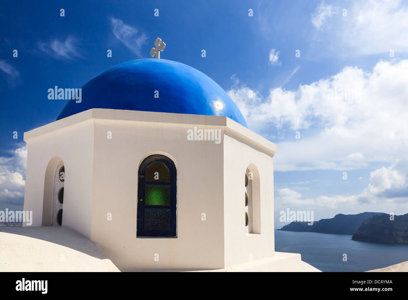 Beautiful blue domed church overlooking the Aegean Sea at Oia Santorini Greece Europe Stock Photo