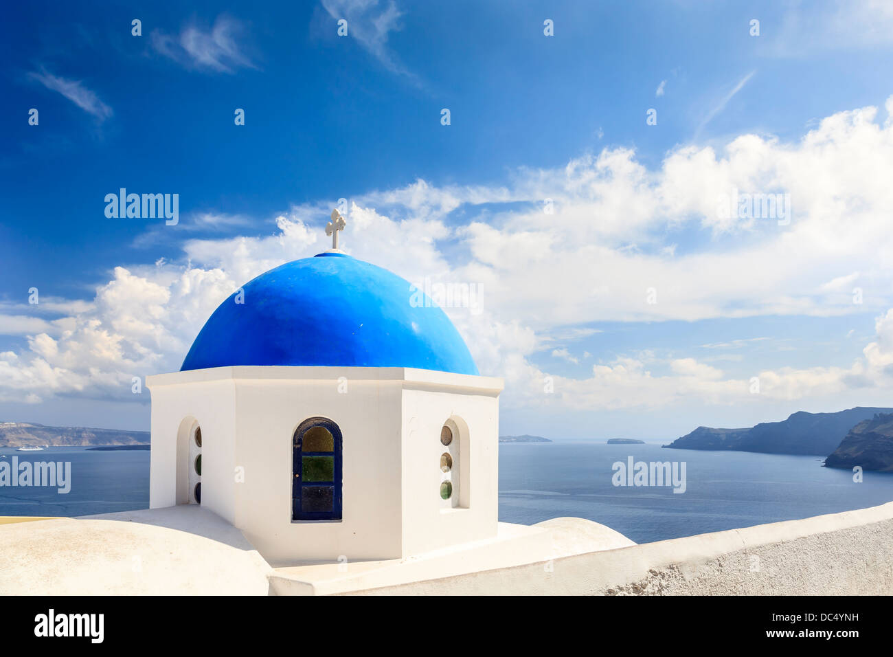 Beautiful blue domed church overlooking the Aegean Sea at Oia Santorini Greece Europe Stock Photo