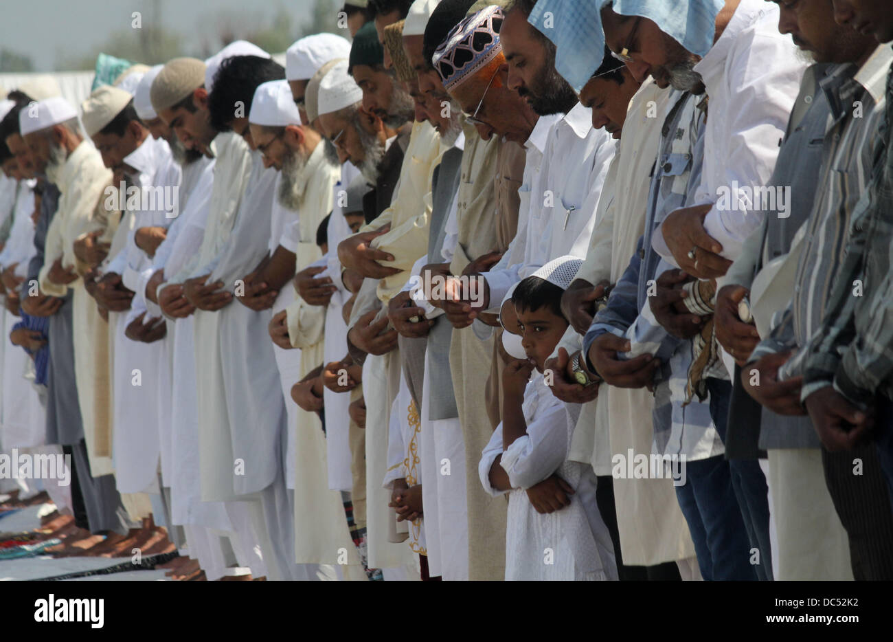 Srinagar, Kashmir, India. 09th Aug, 2013. Kashmiri Muslim's offer prayers  on the occasion of Eid-al-Fitr in Srinagar, the summer capital of indian  kashmir on 9/8/2013 Eid-al-Fitr marks the end of Ramadan, the, image size:1300x934