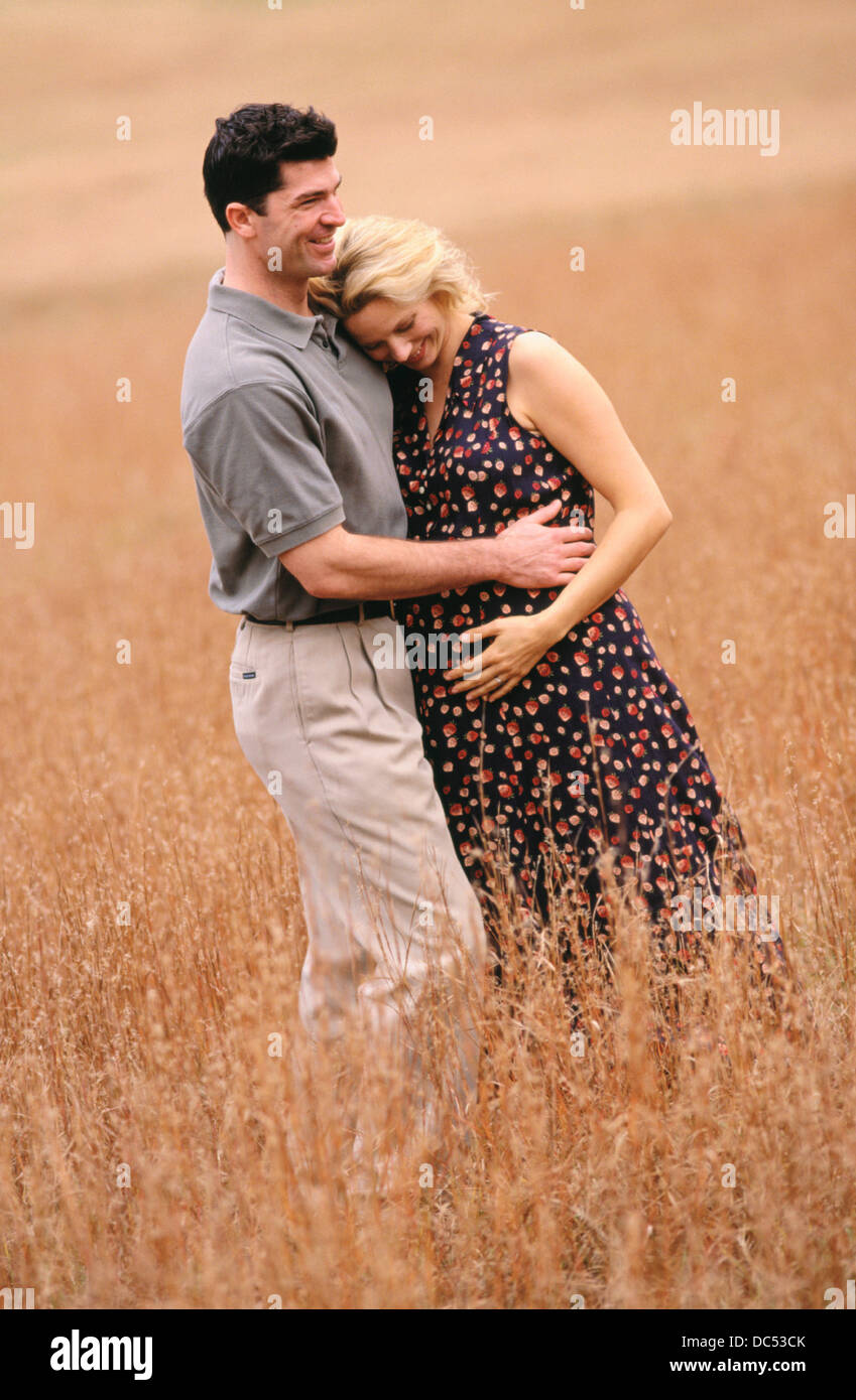 Man and pregnant woman Stock Photo - Alamy