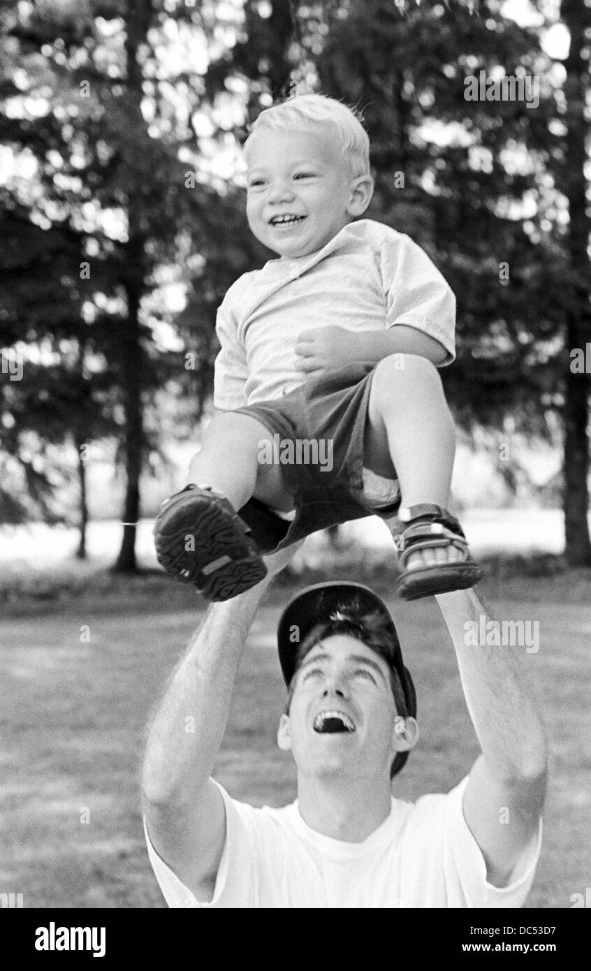 Father son bonding at the park Black and White Stock Photos & Images ...