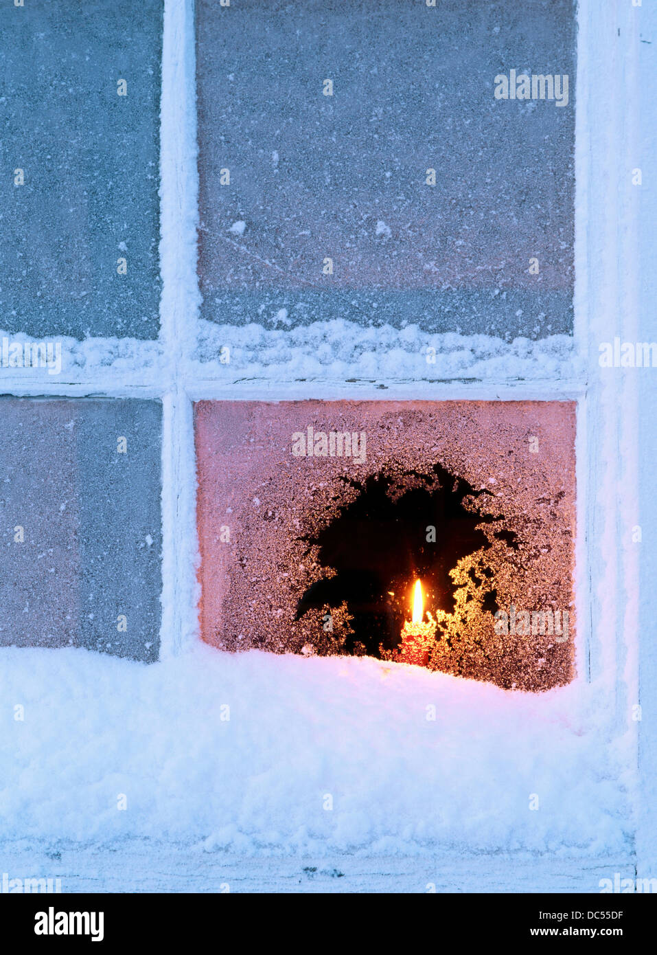 Candle in a frosty window. Västerbotten. Sweden Stock Photo Alamy