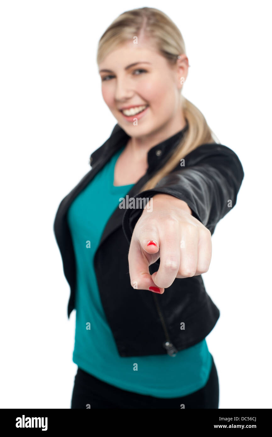 Fashionable teen in leather jacket pointing at you Stock Photo