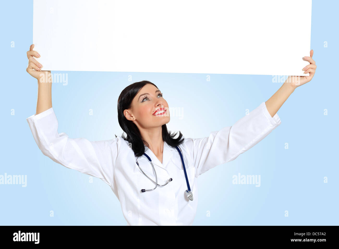 Young female doctor with a banner Stock Photo - Alamy
