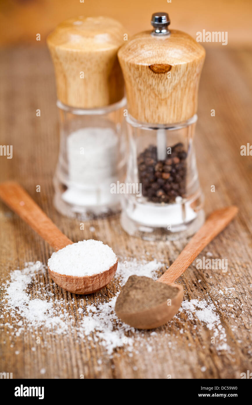 salt and pepper in spoons and shakers Stock Photo Alamy