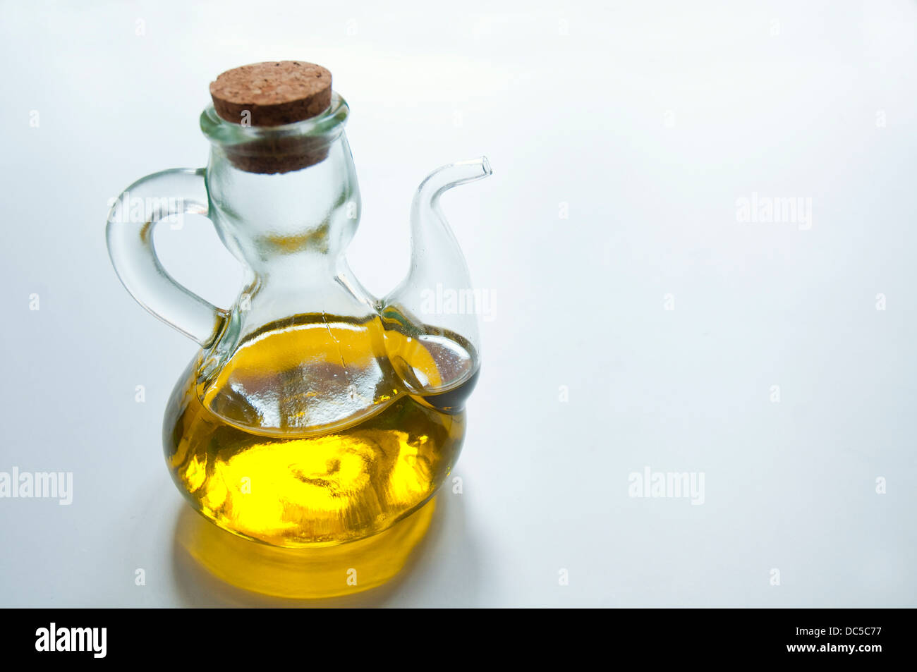 Oil bottle filled with extra virgin olive oil from Spain. Still life. Stock Photo