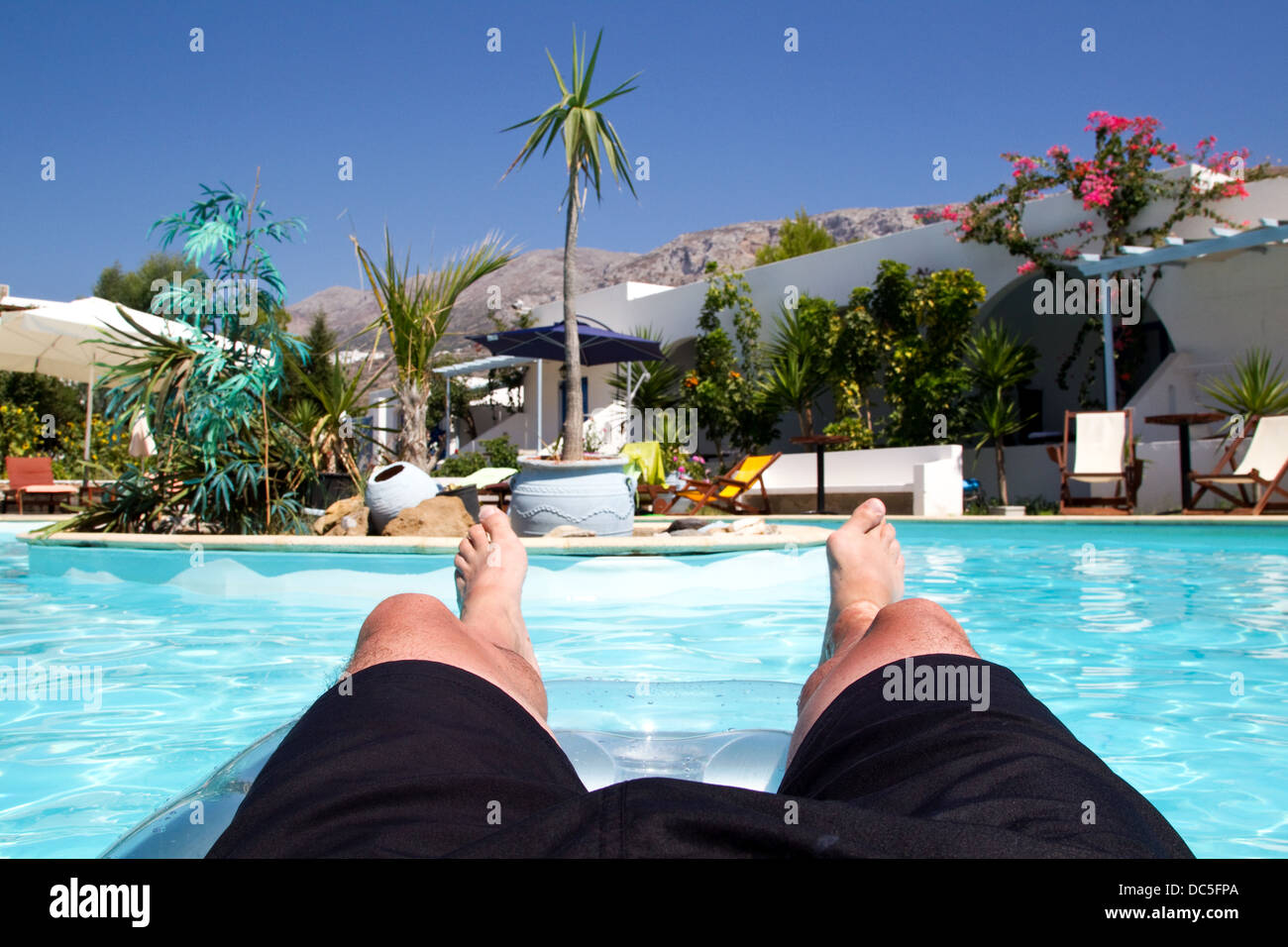View from a Lilo in a swimming pool Stock Photo